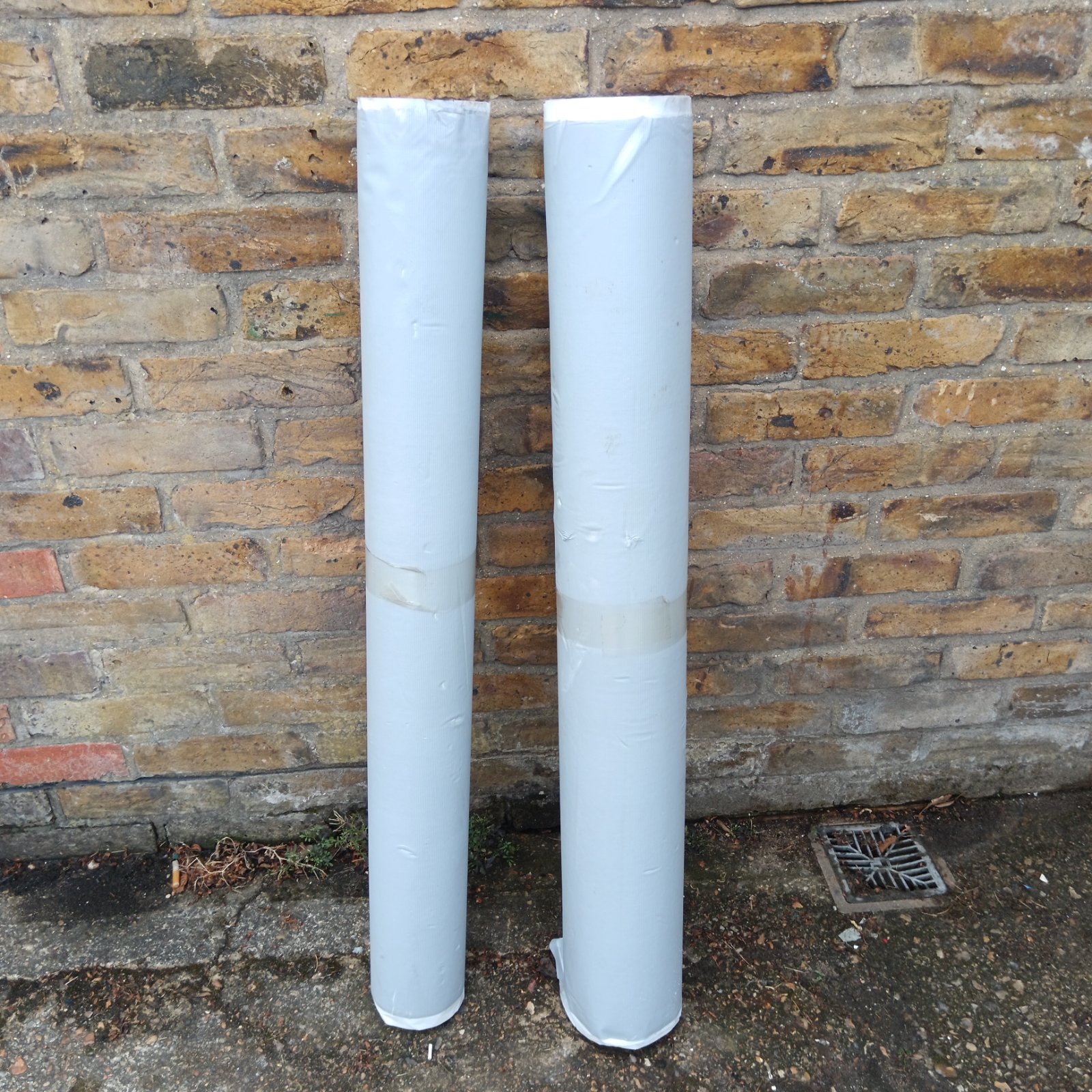Two rolls of Impey shower water guard for bathroom waterproofing.