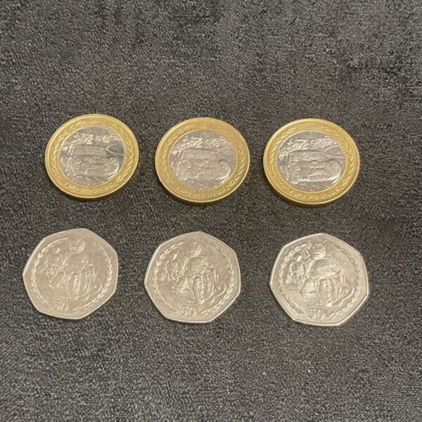 Isle of Man £2 coins featuring castle designs, collectible currency.