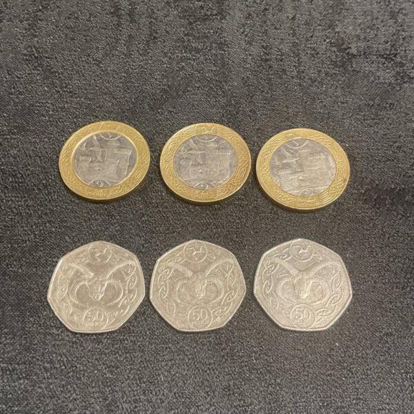 Isle of Man coins featuring Ram Head and Castle designs, collectible currency.