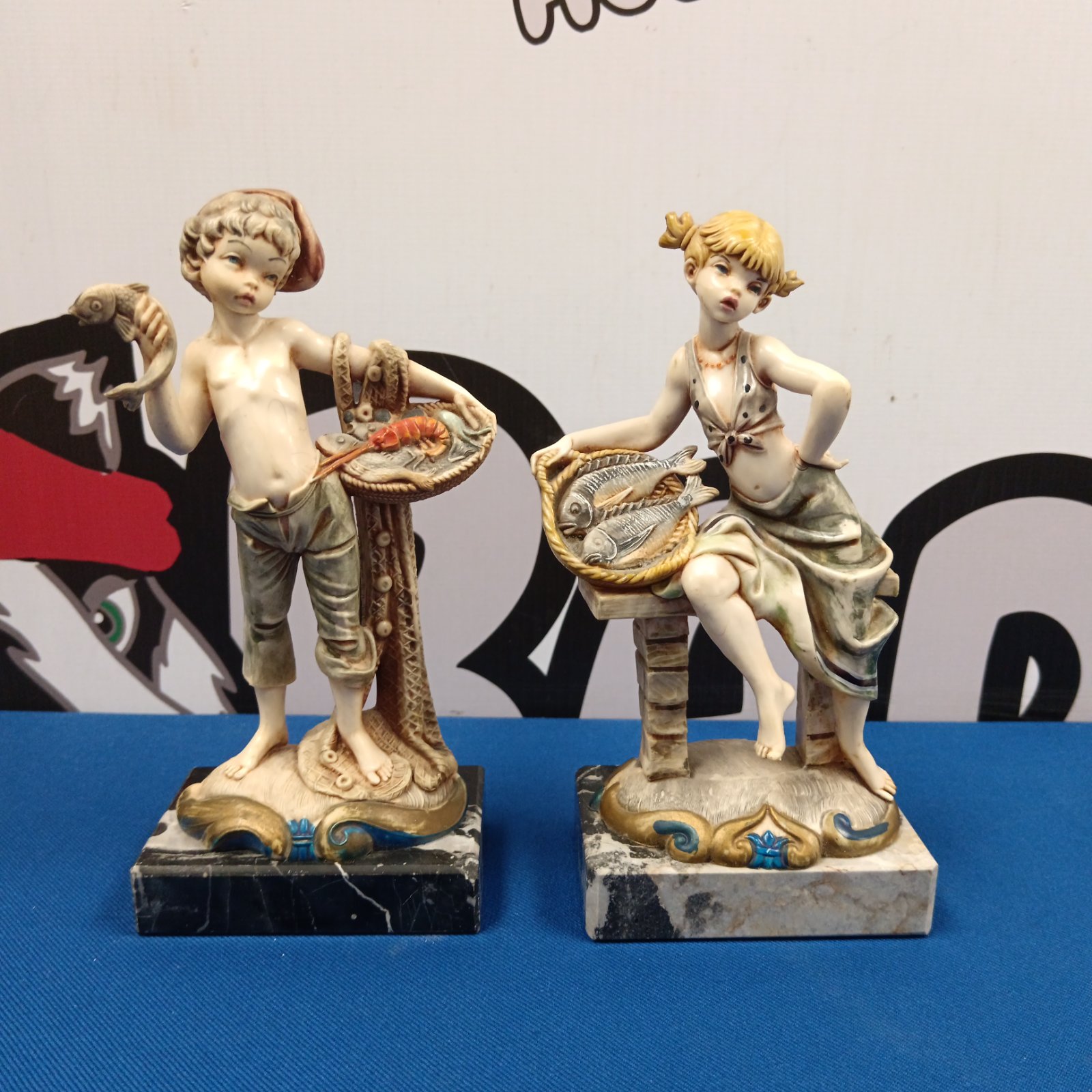 Vintage Italian fish seller figurine of a boy with fish.
