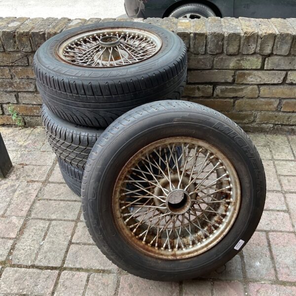 Set of four vintage Jaguar 72 spoke wire wheels.