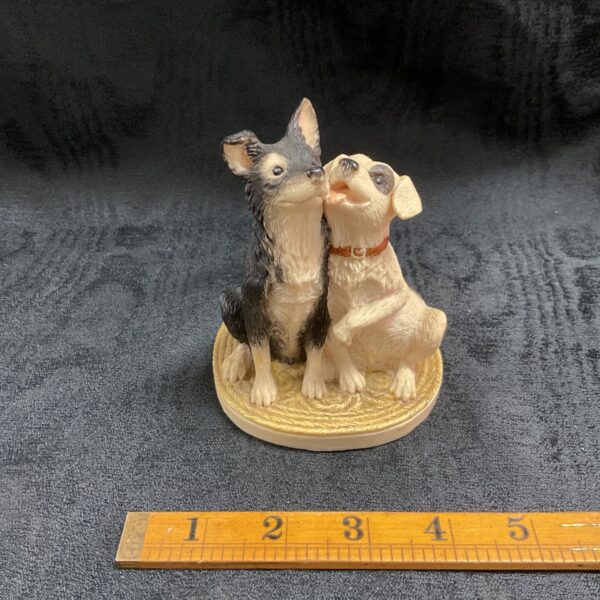 John Beswick Puppy Love figurine showing two puppies nose to nose.