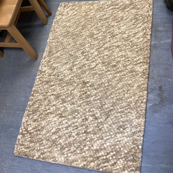 Beige hand knotted John Lewis 'Jelly Beans' rug for living room.