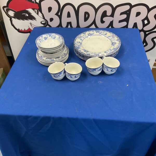 Vintage Johnson Bros dinnerware set with blue floral pattern.