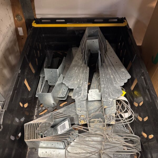 Metal joist brackets in a lot for construction projects.