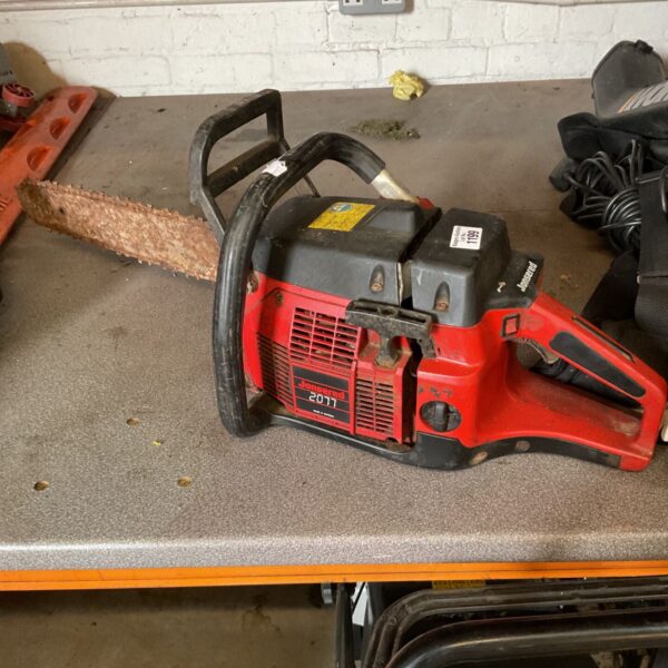 Vintage Jonsered 2077 chainsaw in used condition.