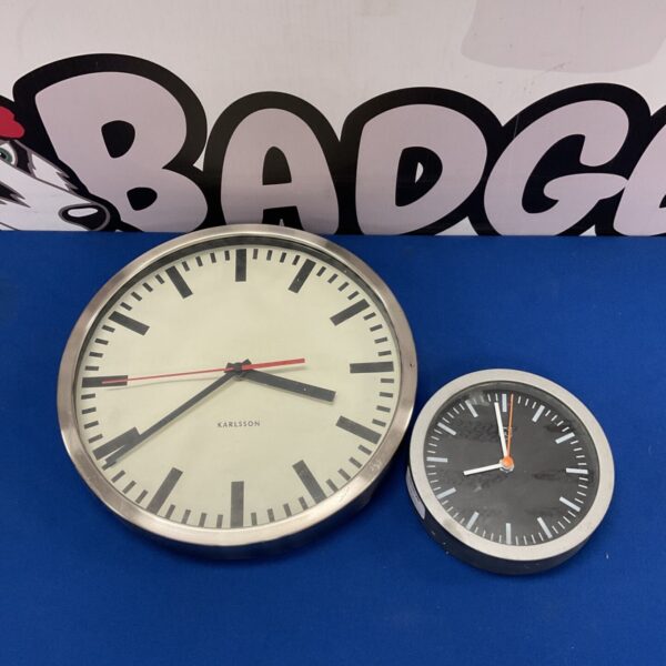 Vintage Karlsson wall clock with a minimalist white face.