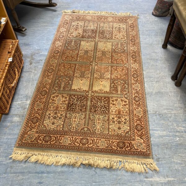 Hand-knotted Kashmiri garden rug in beige and brown tones.