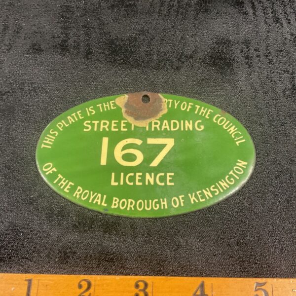 Vintage Kensington street trading enamel plaque with white lettering.