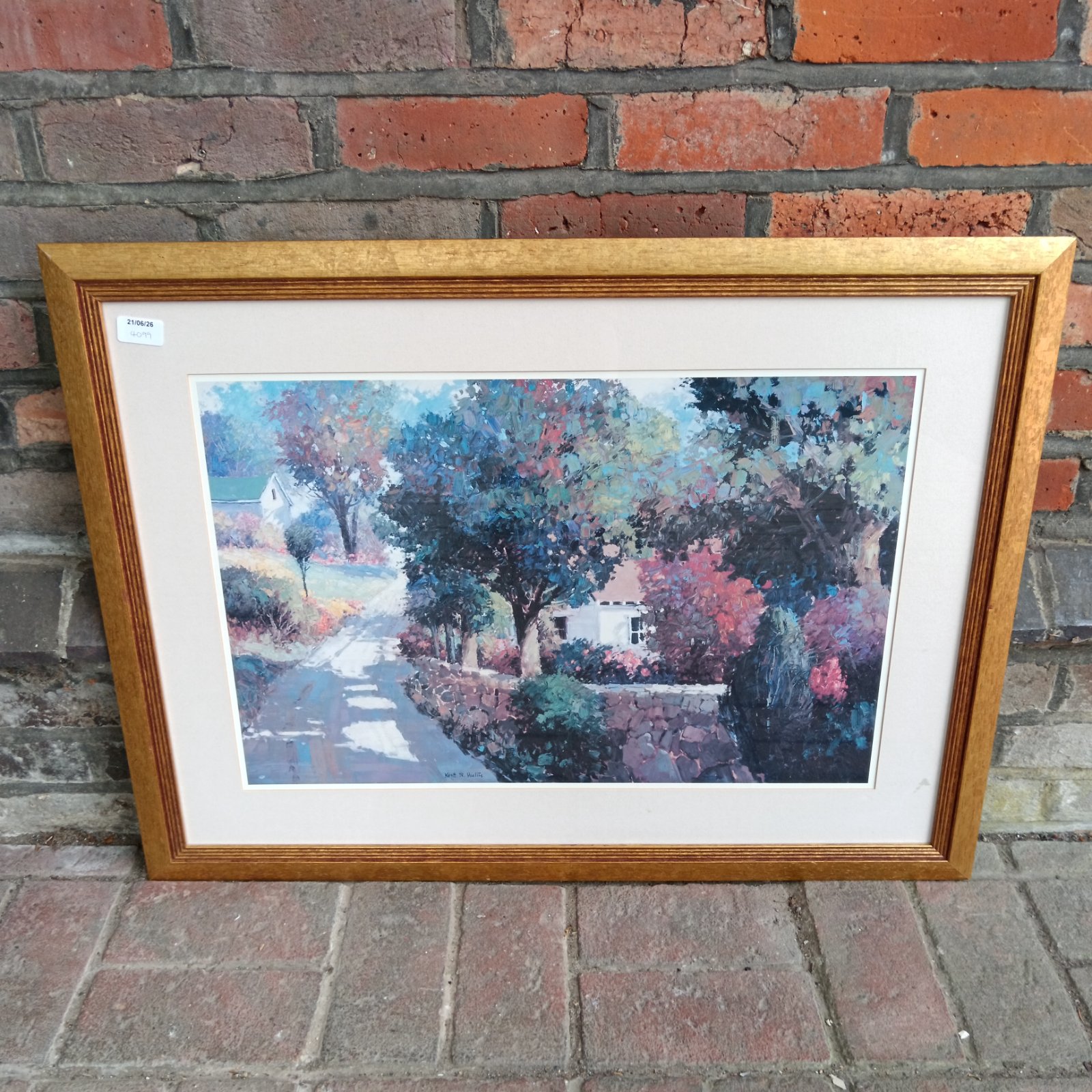 Framed Kent R Wallis print of a country road with a stone wall.