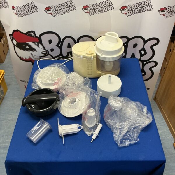 Kenwood food chopper with various attachments for kitchen use.