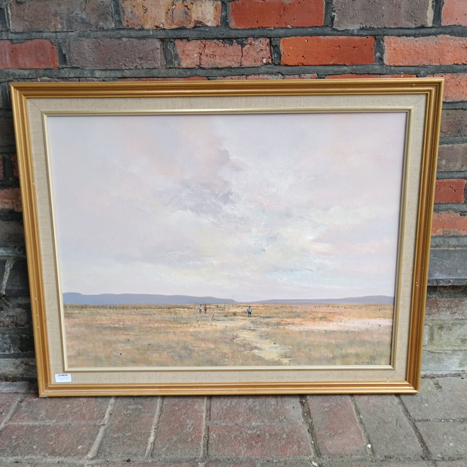 Framed Kevin Stanley painting of a South African savannah landscape.