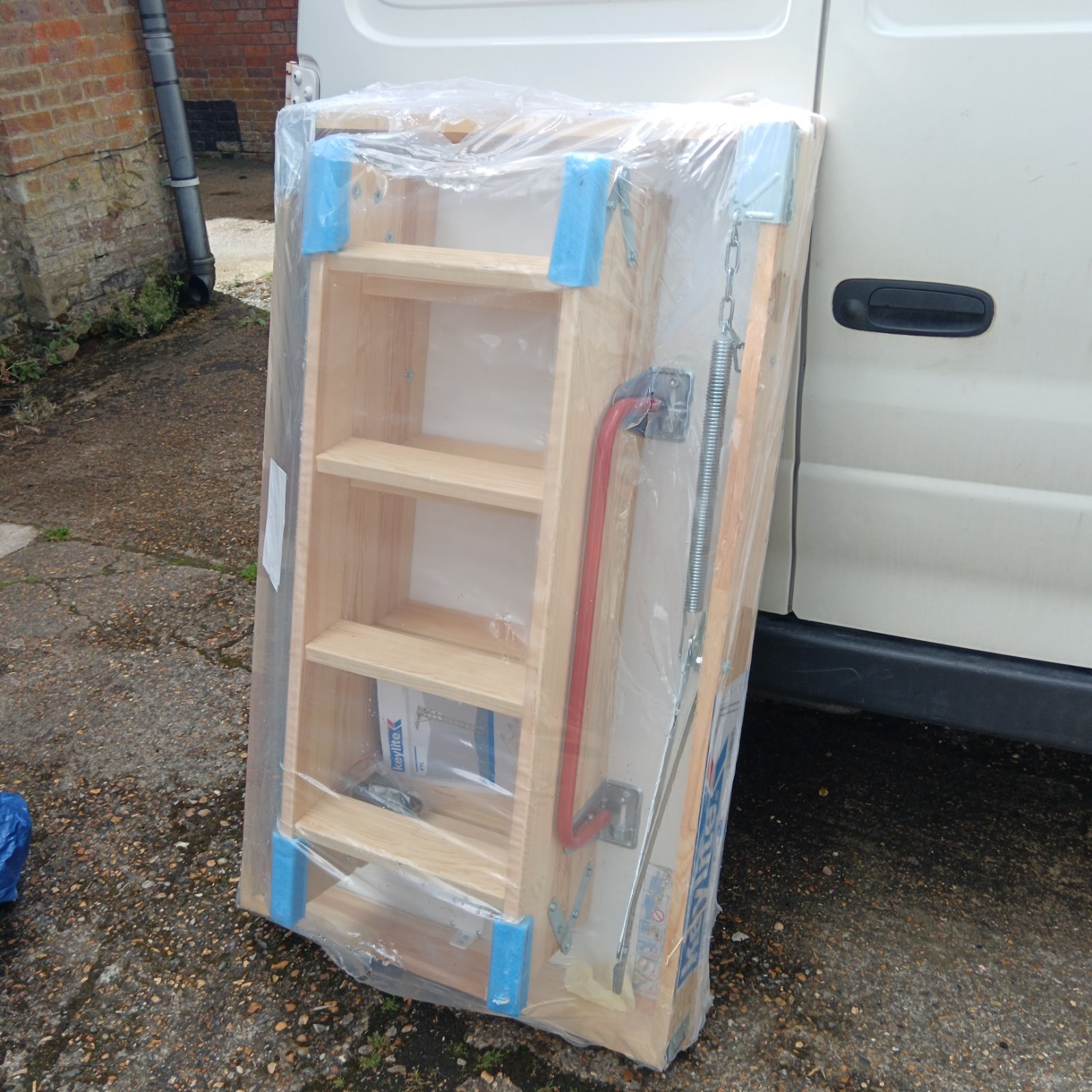 Keylite loft ladder and hatch kit in plastic packaging.