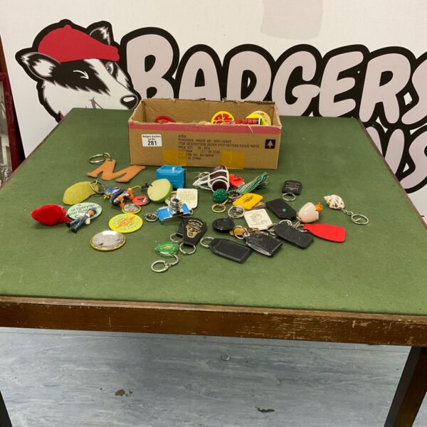 Assorted vintage keyrings and badges lot for collectors.