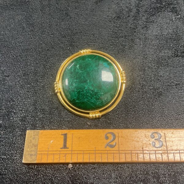 Vintage Kida brooch with a large green jade cabochon.