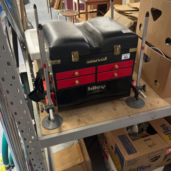 Vintage Kiley Canal fishing seat box with red and black design.