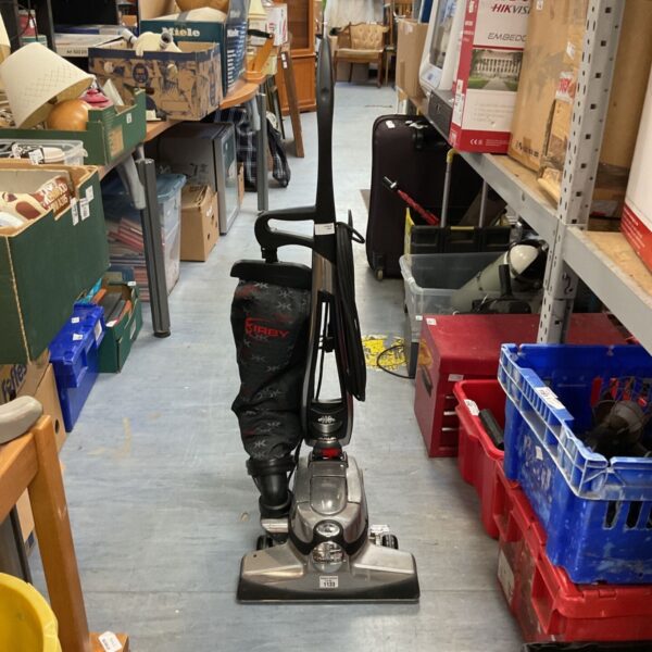 Kirby Avalir vacuum cleaner in used condition, upright home cleaning.