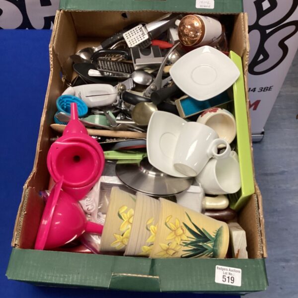 Mixed lot of kitchen utensils including whisks and measuring cups.