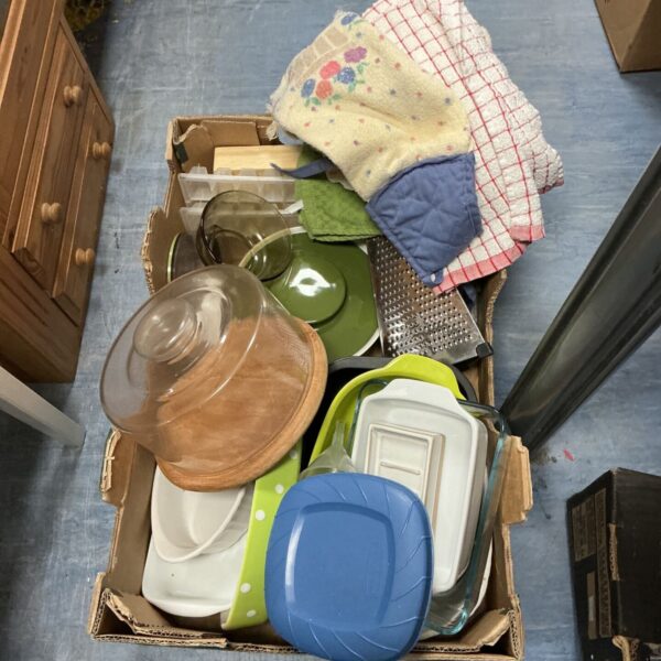 Mixed kitchenware lot including tea towels and casserole dish.