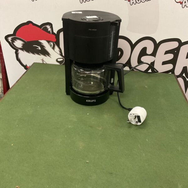Black Krups Pro Aroma coffee machine with glass carafe and UK adapter.
