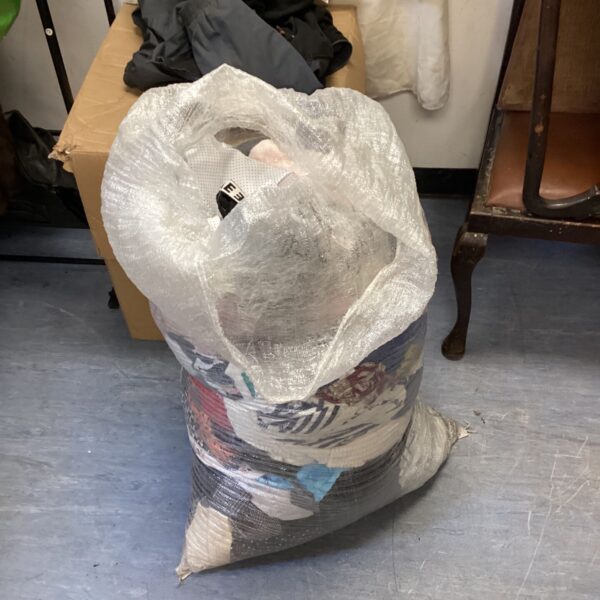 Large job lot of ladies clothing in a plastic bag.