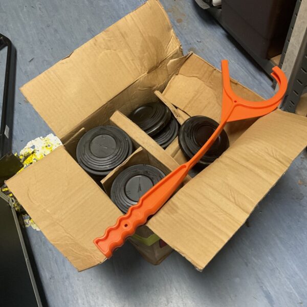 Laporte clay pigeon targets in a box with a target thrower.