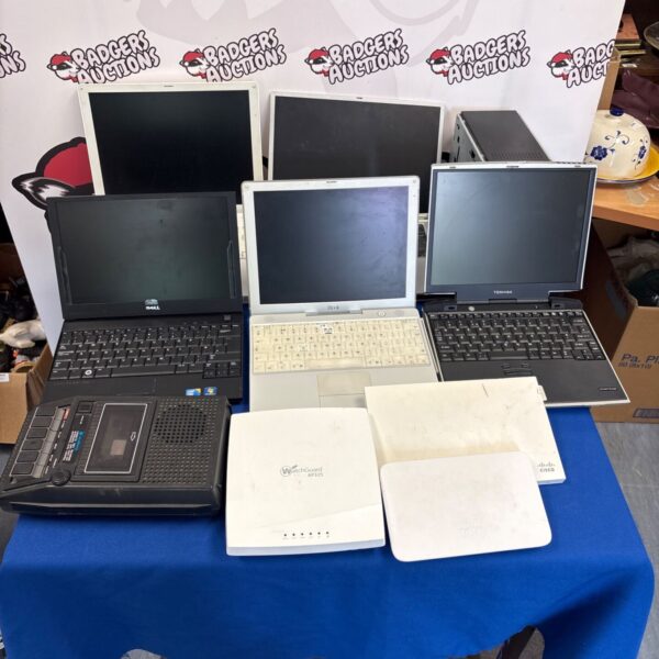 Mixed lot of used laptops and electrical items for auction.