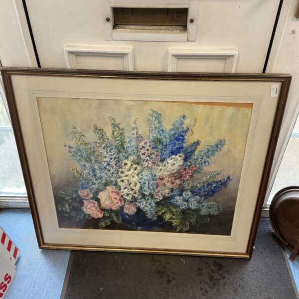 Large framed floral print with blue and white flowers.