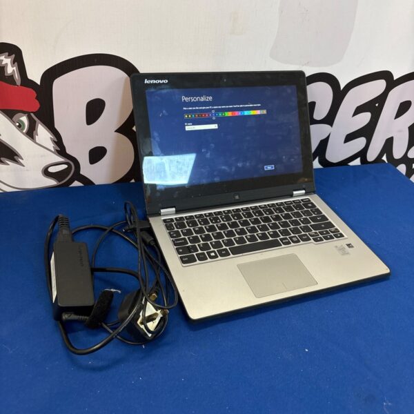 Lenovo Yoga 211 laptop with power supply, convertible touchscreen device.