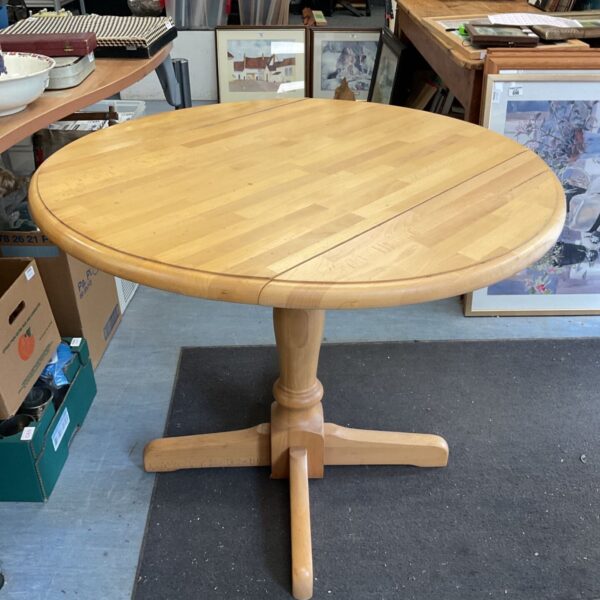 Round beech wood drop leaf table by Liko Les.