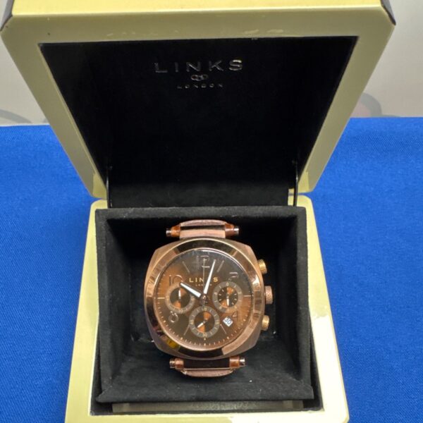 Links of London gents wristwatch with brown leather strap.