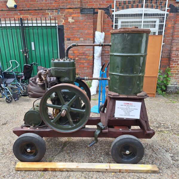 Vintage Lister stationary engine on trolley, front view.