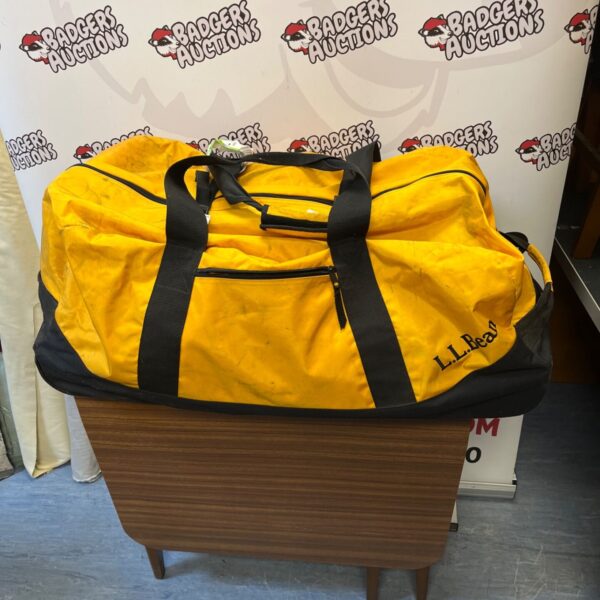 Yellow and black L.L.Bean duffel bag with sturdy handles.