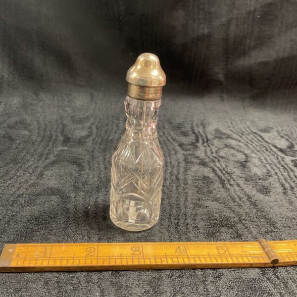 Hallmarked silver kn pepper spoon and glass jar