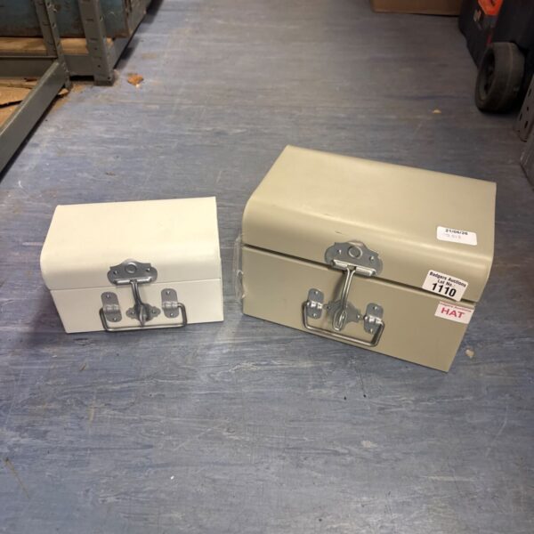Two metal cash tins