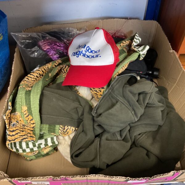 Box of assorted items including hats and hair curler