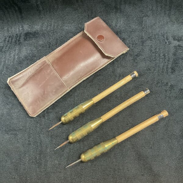 Sey of vintage heavy brass wood shaft darts in case