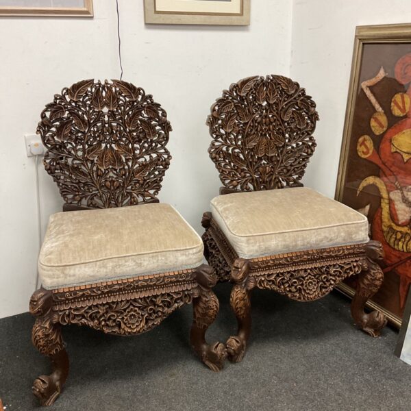 Pair of anglo Indian hand carved wooden chairs
