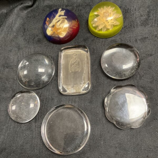 Collection of photograph paperweights and two resin paperweights
