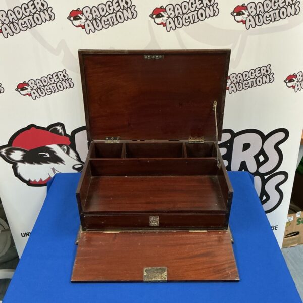 Vintage mahogany campaign box with drawer open.