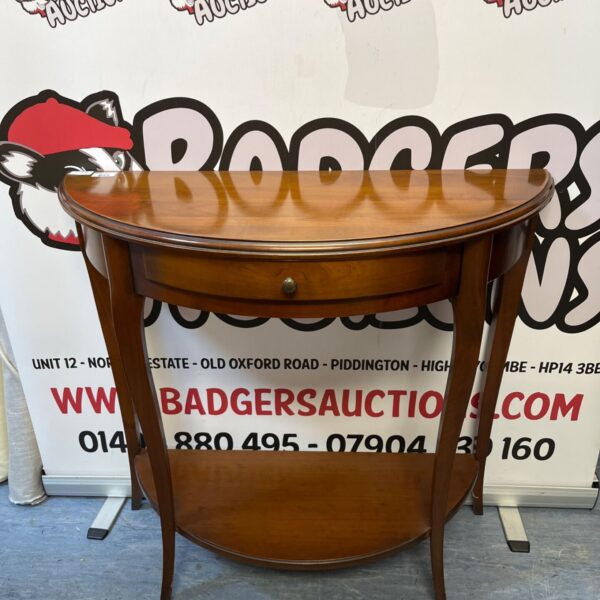 Antique mahogany console table with curved legs.