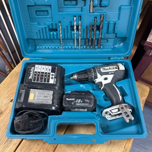 Makita 18V cordless drill set in open carrying case with bits.