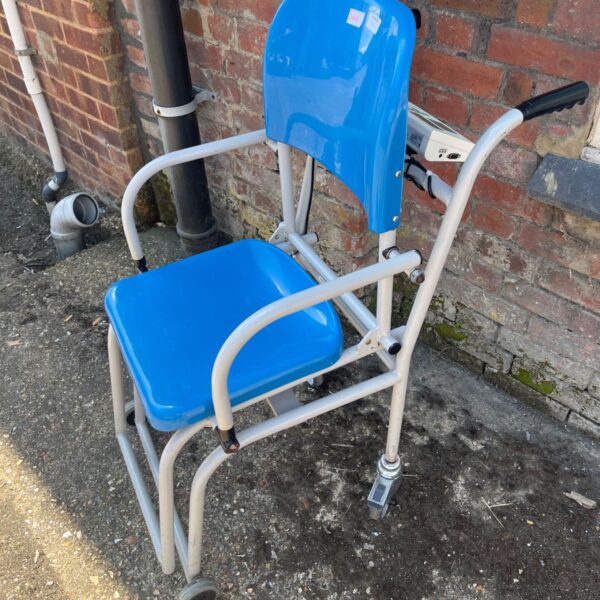 Blue Marsden M-225 patient chair scale with wheels and digital display.