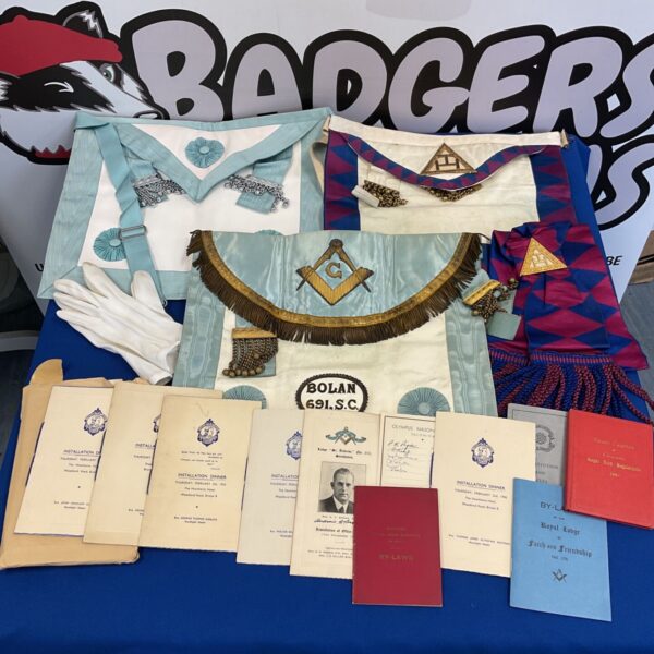 Vintage collection of 1950s Masonic aprons and ephemera for collectors.