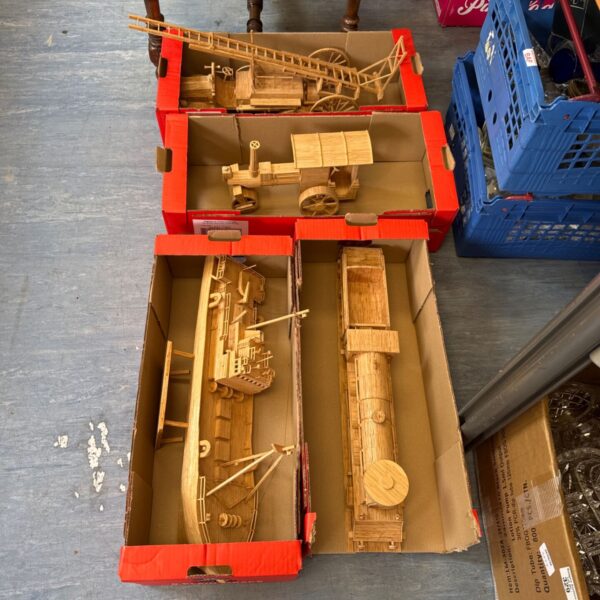 Detailed matchstick models of a locomotive, ship, steam engine and fire truck.