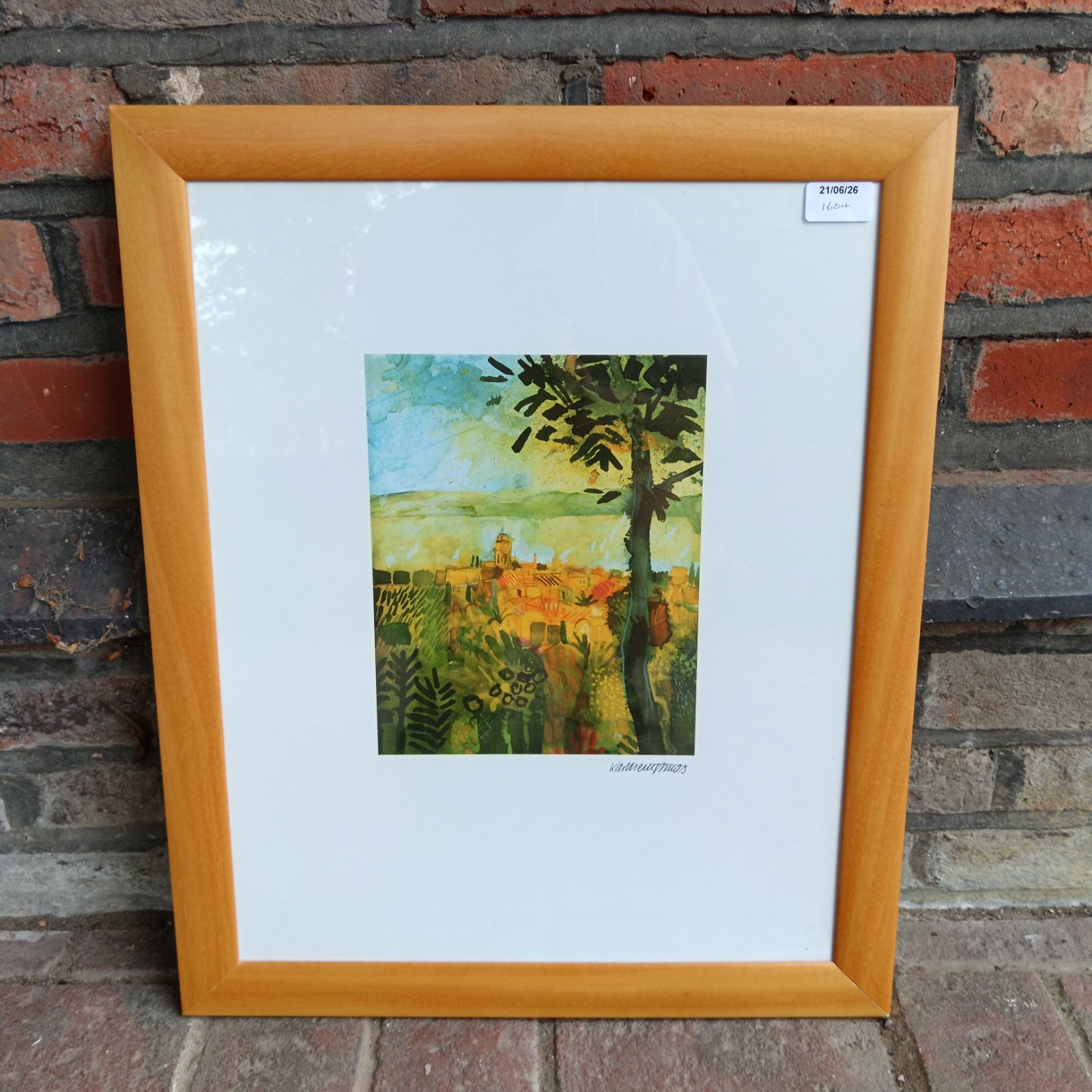 Framed Mediterranean townscape print with colourful buildings and coastal views.