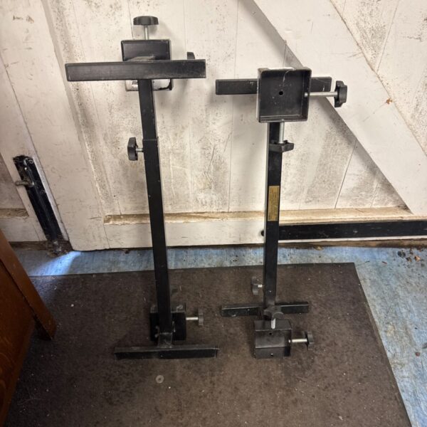 Pair of metal chair raisers for added seating height.