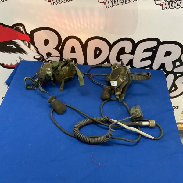 Vintage military headset with connecting cable for radio communication.