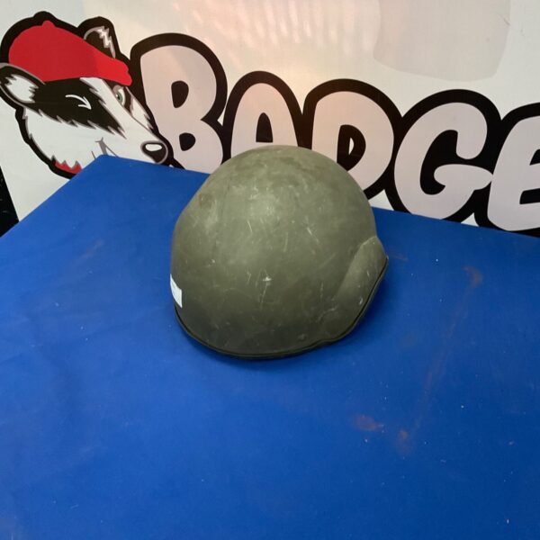 Vintage military tank crew helmet in steel, showing signs of wear.