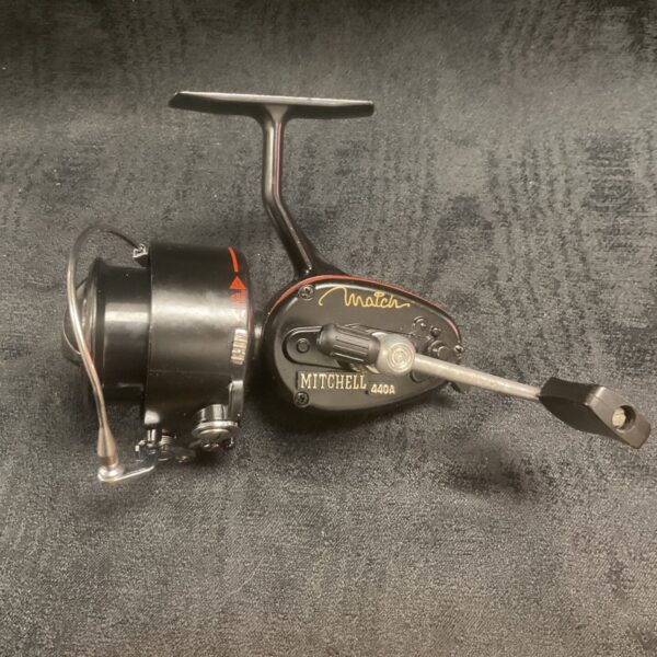 Close-up of a vintage Mitchell Match 440A fishing reel.